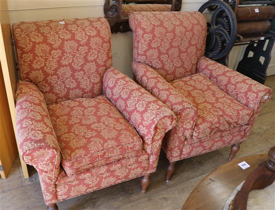 A pair of armchairs, with foliate patterned russet upholstery